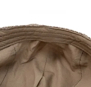Detail view of cotton inner lining and care label of a breathable mesh summer flat cap