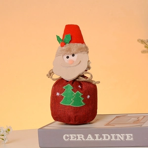 Christmas burlap gift bag featuring a 3D Santa Claus figure and drawstring closure