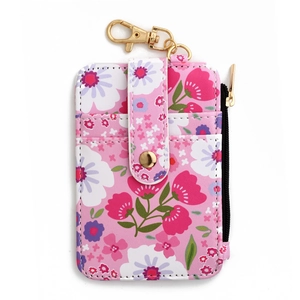 Detailed view of pink floral card holder with gold snap button and side zipper pocket