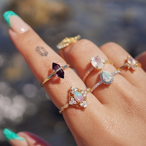 Detailed view of luxury S925 silver rings set with colorful crystals and moonstone gems