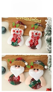 Close-up of plush Christmas ornaments with Santa and snowman on a festive tray