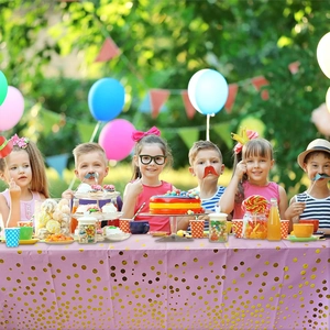 Pink and gold polka dot rectangular party tablecloth used for children's birthday events