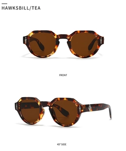 Detailansicht der runden Schildpatt-Sonnenbrille mit silbernen Dolch-Applikationen