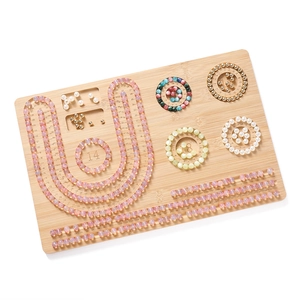Bamboo bead design board with measurement scales and jewelry making tool compartments