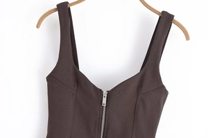 Detail of dark brown tank top featuring front metal zipper and sturdy wide shoulder straps