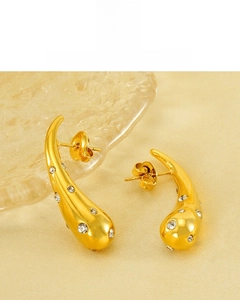 Detail of 18K gold plated teardrop earrings with shimmering cubic zirconia stones