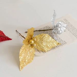 Golden and silver glitter leaves with berries for Christmas tree and wreath decoration