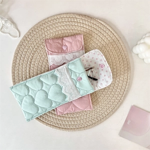 Close-up of heart quilted soft sunglasses pouch with delicate white lace trim detail