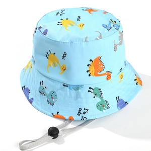 Detail of light blue kids sun hat with cartoon dinosaurs and adjustable chin strap