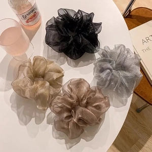 Sparkling mesh scrunchies set in black, silver, champagne, and bronze colors for summer