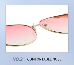 Detailed macro view of comfortable silicone nose pads and golden metal frame on sunglasses