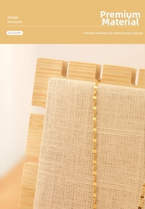 Detailed view of linen necklace display stand with bamboo frame and golden chain