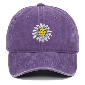 Close-up of vintage washed purple cotton baseball cap with white daisy embroidery