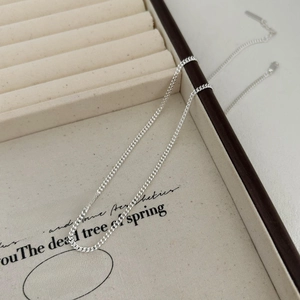 Elegant 925 sterling silver curb chain necklace displayed in a premium jewelry box