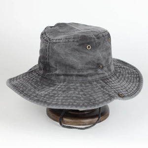 Dark grey washed cotton bucket hat with adjustable chin strap and metal air vents for hiking