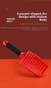 Macro view of a red curved vented hair brush with boar bristles and non-slip handle