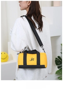 Modern yellow and black nylon cylinder crossbody bag shown on a model for casual style