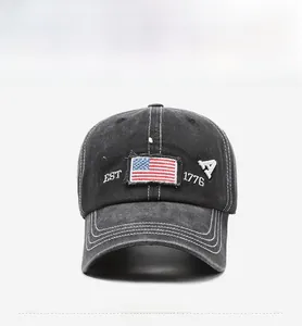 Close-up of vintage washed baseball cap featuring America flag embroidery and text