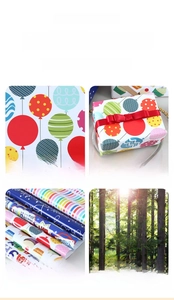 Detail of colorful birthday wrapping paper with balloon and stripe patterns on coated paper