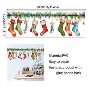 Detail view of 90x30cm PVC Christmas wall stickers with festive socks and green pine needles