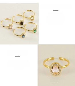 Close-up of adjustable gold plated stainless steel rings with colorful oval zircon stones