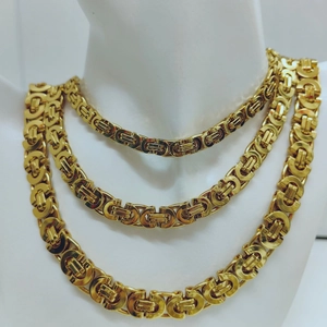 Detailed layered look of three golden Byzantine chains in various widths on a model