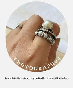 Detailed view of multilayer vintage pearl ring featuring crystal accents and silver finish