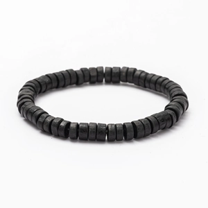 Close-up of black coconut wood bead bracelet showing natural texture and minimalist style