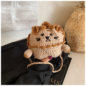 Close-up of handmade crochet lion bag featuring intricate knit texture and cute design