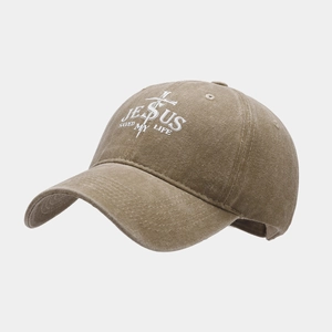 Macro detail of washed brown cotton baseball cap with Jesus Saved My Life print