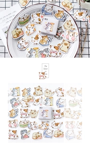 Macro detail of cute hand-drawn cat stickers for DIY planners in a decorative gift box