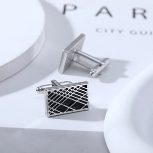 Polished silver cufflinks with black grid enamel inlay and classic T-bar closure