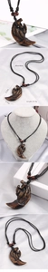 Detail showing the wolf tooth pendant dimensions of 5.3cm x 3.2cm and weight of 15.5g