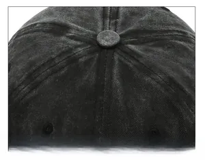 Detailed close-up of the vintage washed cotton baseball cap crown with reinforced stitching