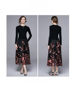 Detail of high-waisted skirt with exquisite red and gold plum blossom embroidery