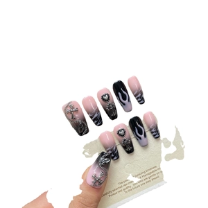 Y2K punk style press-on nails with pink black gradient, flame patterns and metal charms