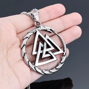 Detailed view of Viking Valknut pendant with intricate weave texture on a steel chain