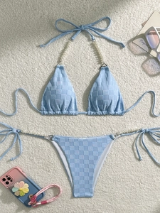 Light blue checkerboard bikini set with decorative pearls and textured terry fabric