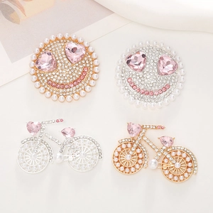 Sparkling crystal smiley face and bicycle brooches with pink hearts and pearls