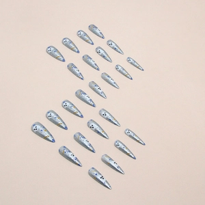 Long stiletto press-on nails with silver base and colorful pop art ghost eye patterns