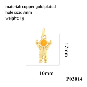 Macro detail of gold-plated astronaut pendant with size measurements and 18K finish