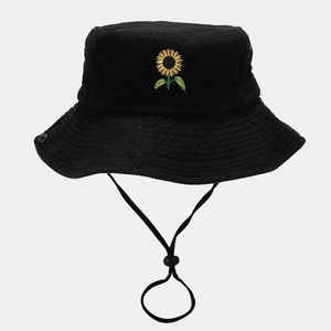 Detail of sunflower embroidery on black cotton bucket hat with adjustable wind rope