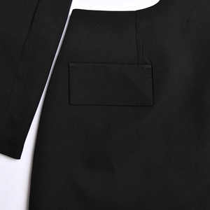 Detailed close-up of high-quality black woven fabric texture and seamless pocket stitching
