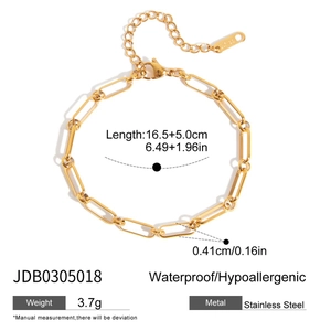Detailed macro view of 18k gold-plated stainless steel paperclip chain with rhinestones