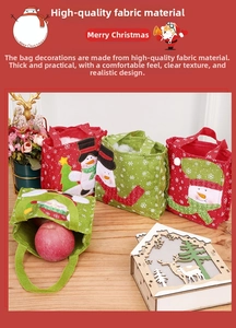 Detail of Christmas snowman felt gift bag with festive embroidery on a wooden table