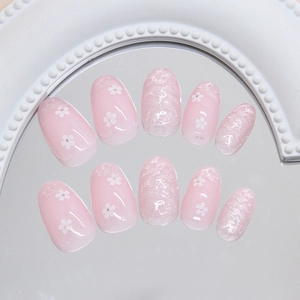 Pink cat eye press on nails with delicate 3D floral accents and silver glitter finish