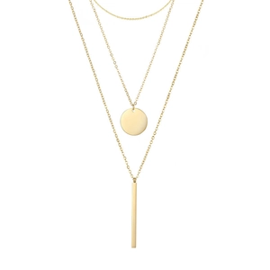 Close-up of three-layered gold necklace with circular disc and vertical bar pendants