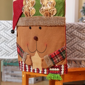 Brown reindeer Christmas chair cover with plush antlers and plaid accents for holiday decor