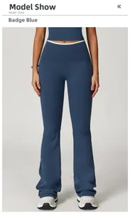 Macro view of high-waist yoga flare pants in badge blue showing matte fabric and stitching