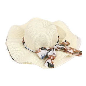 Elegant wide brim straw sun hat with vintage floral bow ribbon in cream white color